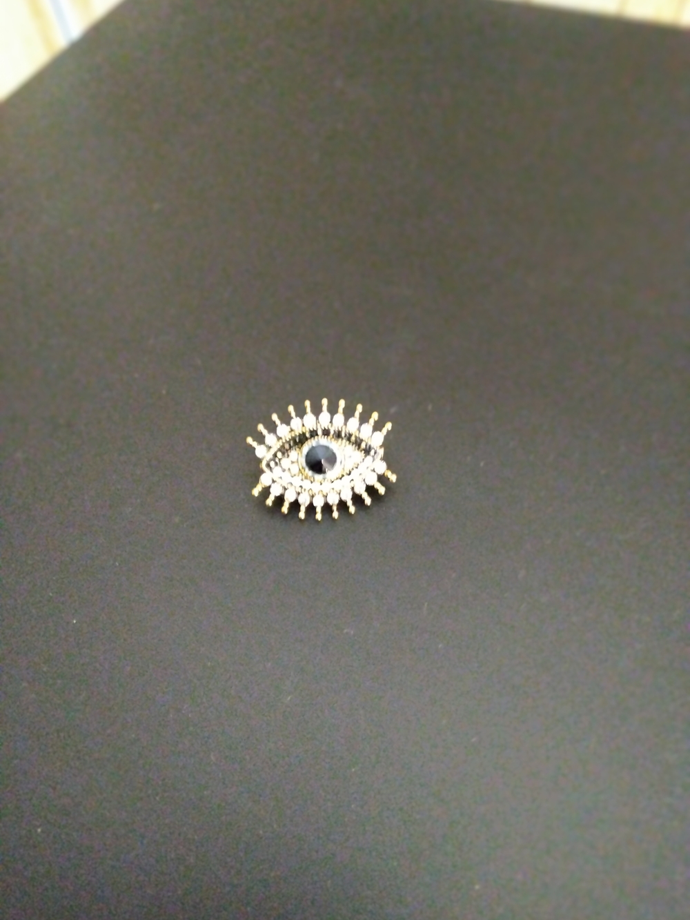 Gold-Tone Evil Eye Pin with Black Center ( Coin Not Included Just Show The Size)